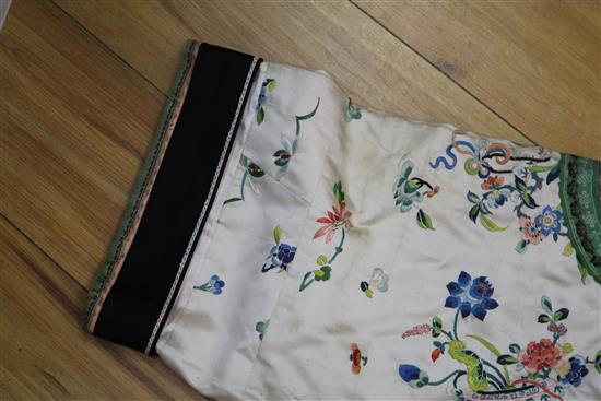 A Chinese embroidered silk ladys jacket and pair of shoes